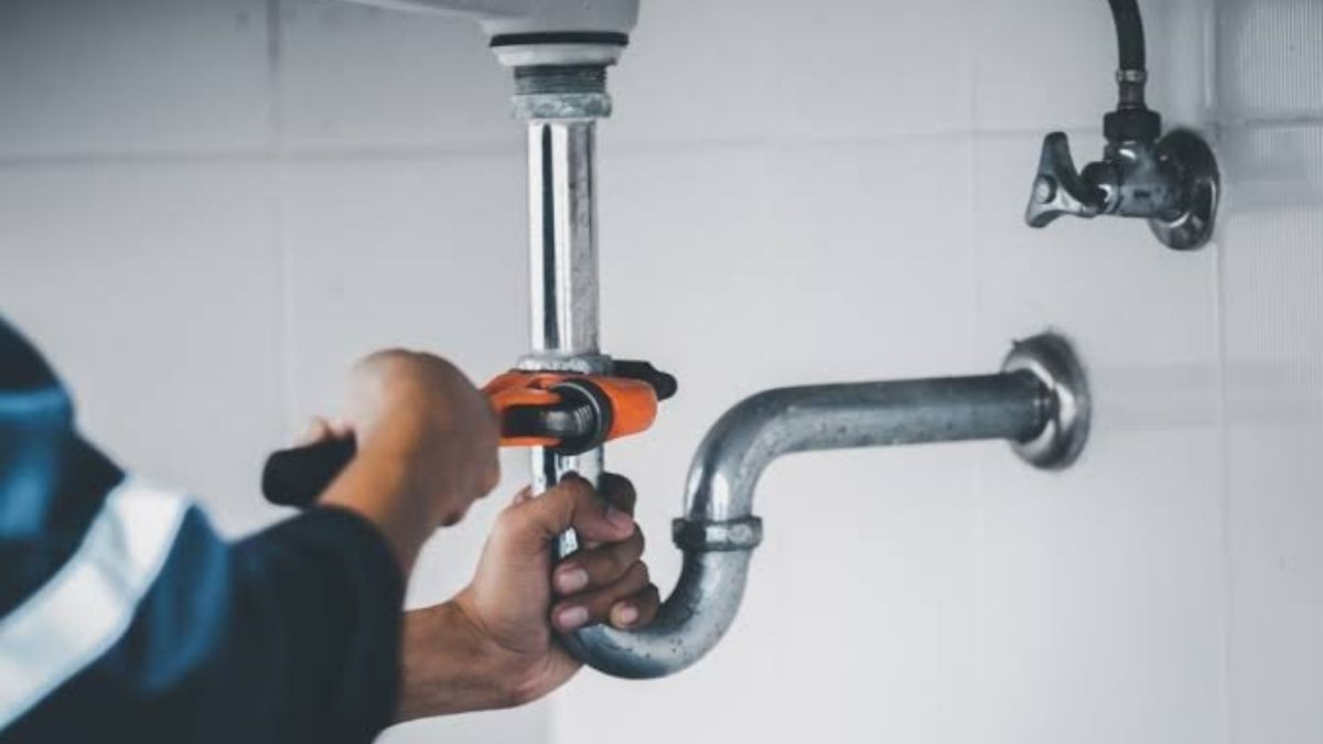 Plumber installing new copper pipe during a repipe in Lancaster, CA