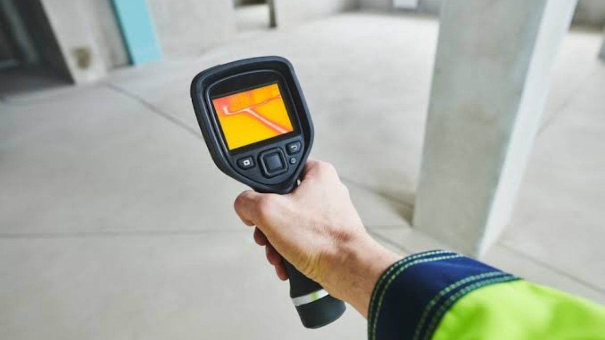 Plumber using leak detection equipment on a slab floor in Lancaster, CA